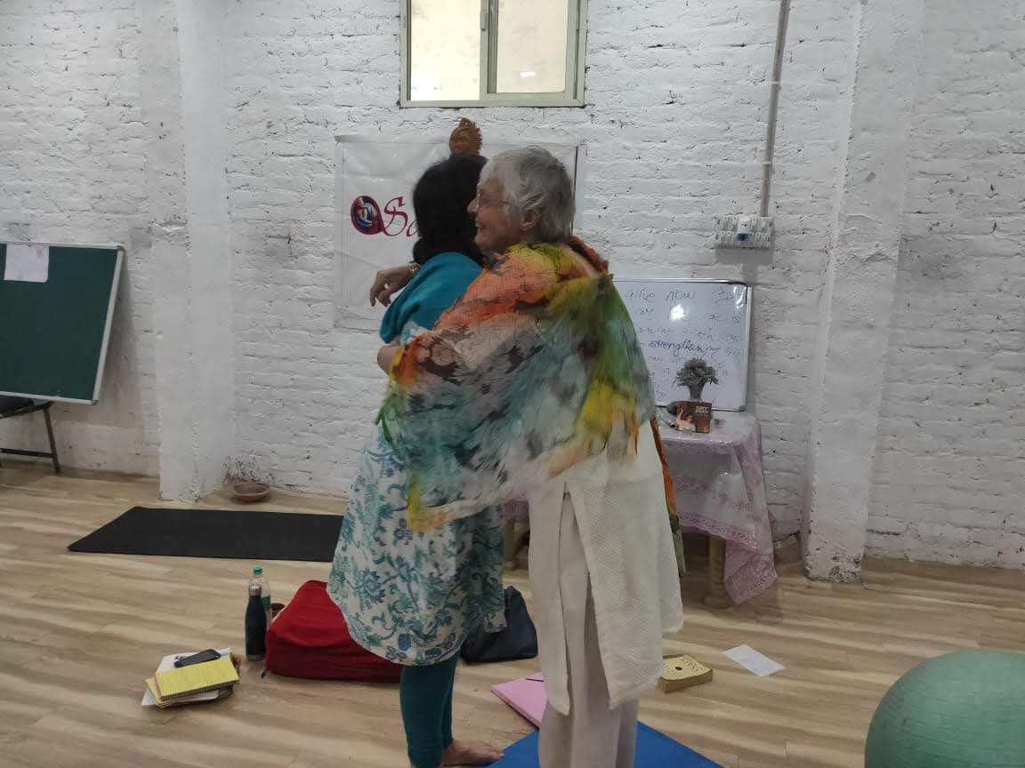 Participant receiving a blessing after completing training at Samvedna